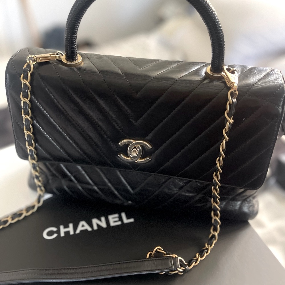 Authentic Chanel Flapbag with handle and chain strap